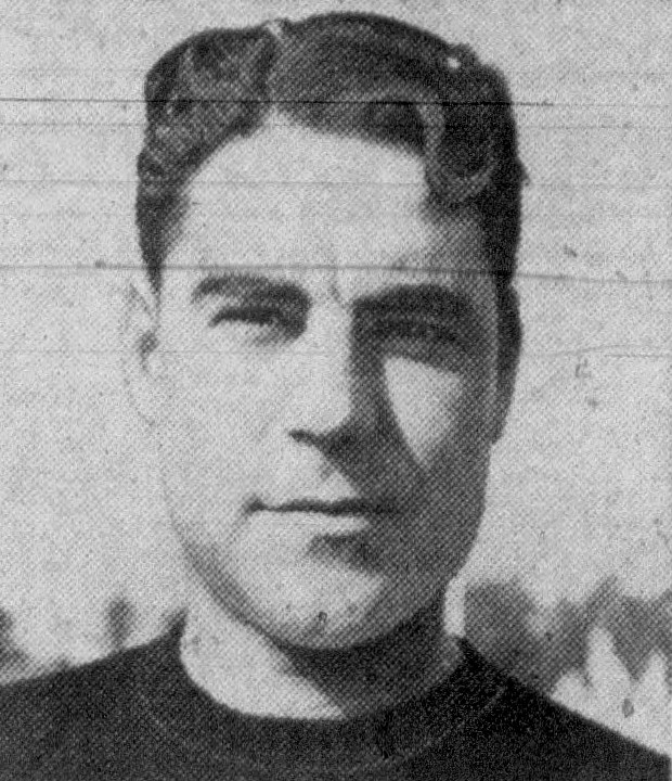 A grainy, black-and-white headshot of Hall of Fame player and coach Marchmont Schwartz from 1942. He is shown from the shoulders up, wearing a dark crew-neck athletic sweater. He has dark, wavy hair and a slight, confident smile, looking directly at the camera. The image has the textured appearance of a vintage newspaper clipping.