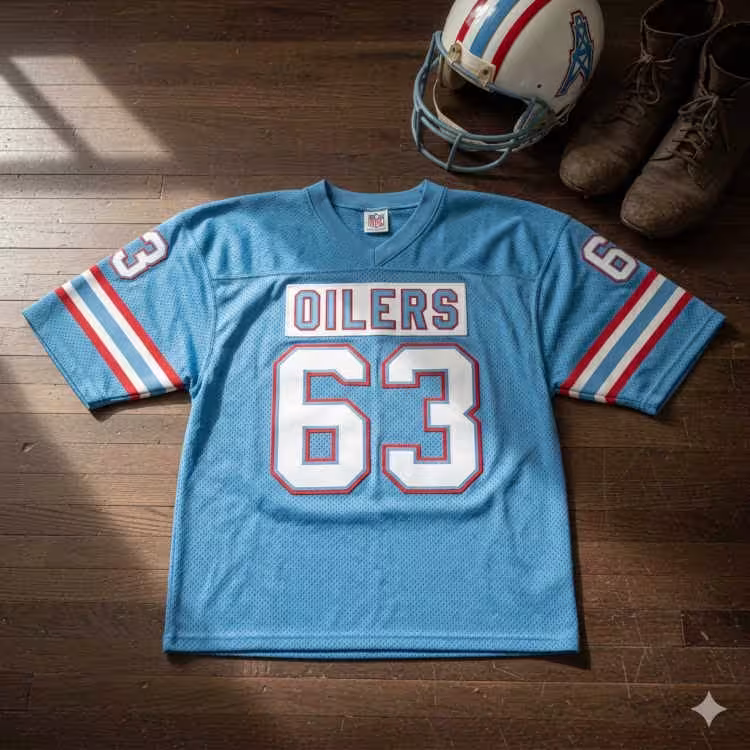 Image of a blue football Jersey number 63 with a football helmet and old cleats.