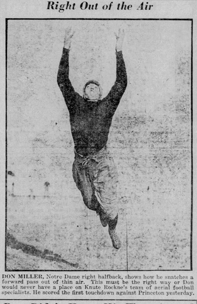 1923 archival photo of Notre Dame 'Four Horseman' Don Miller leaping for a catch against Princeton.