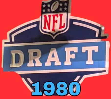 NFL Draft sign in color on a reddish background with the year 1980 text across the bottom in blue. The original cropped image was taken by Darin Hayes at AT&T Stadium in 2022.