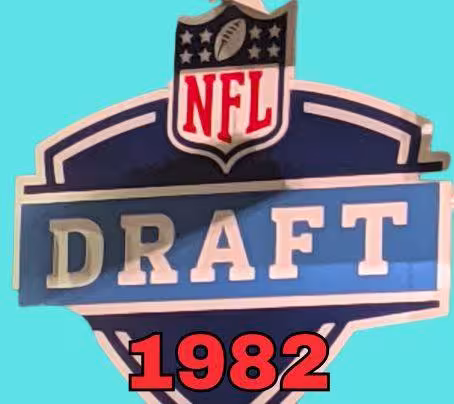 NFL Draft sign in color on a aqua background with the year 1982 text across the bottom in bright red. Original cropped image was taken by Darin Hayes at AT&T Stadium in 2022.