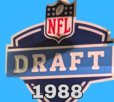 NFL Draft sign in color on a blue background with the year 1988 text across the bottom in bright gray. The original cropped image was taken by Darin Hayes at AT&T Stadium in 2022.