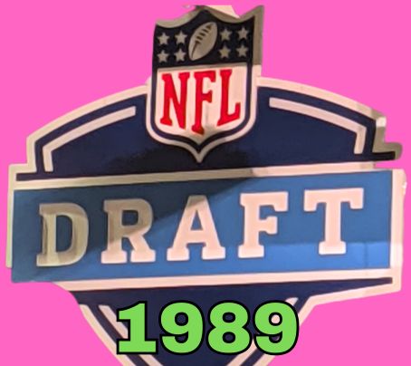 NFL Draft sign in color on a purple background with the year 1989 text across the bottom in bright green. The original cropped image was taken by Darin Hayes at AT&T Stadium in 2022.