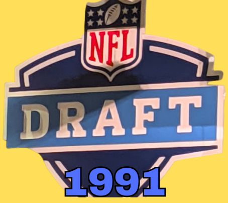 NFL Draft sign in color on a yellow background with the year 1991 text across the bottom in bright blue. Original cropped image was taken by Darin Hayes at AT&T Stadium in 2022.