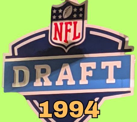 NFL Draft sign in color on a light green background with the year 1994 text across the bottom in bright peach. The original cropped image was taken by Darin Hayes at AT&T Stadium in 2022.