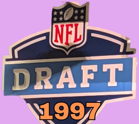 NFL Draft sign in color on a purple background with the year 1997 text across the bottom in bright green. Original cropped image was taken by Darin Hayes at AT&T Stadium in 2022.