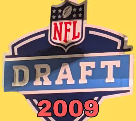 NFL Draft sign in color on a yellow background with the year 2009 text across the bottom in red. The original cropped image was taken by Darin Hayes at AT&T Stadium in 2022.