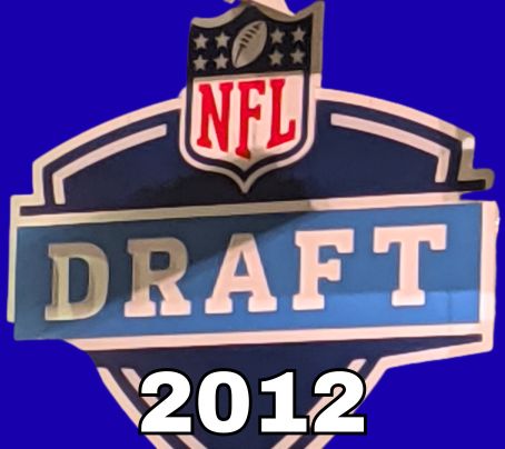 NFL Draft sign in color on a blue background with the year 2012 text across the bottom in white. The original cropped image was taken by Darin Hayes at AT&T Stadium in 2022.