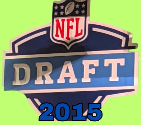 NFL Draft sign in color on a light green background with the year 2015 text across the bottom in blue. The original cropped image was taken by Darin Hayes at AT&T Stadium in 2022.