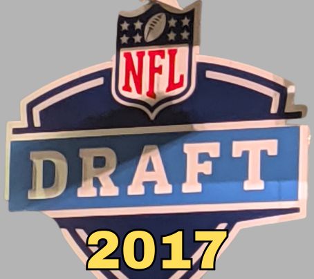 NFL Draft sign in color on a gray background with the year 2017 text across the bottom in bright yellow. The original cropped image was taken by Darin Hayes at AT&T Stadium in 2022.