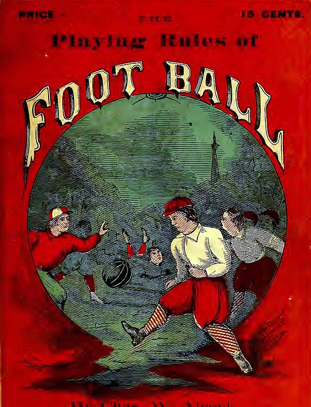 Color rule book cover of 1871 Rules of football. Bright red backdrop with a circular image of men playing a form of football