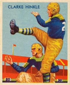 1955 Topps All-American Clarke Hinkle football card. Vintage color-illustrated card featuring Green Bay Packers legend Clarke Hinkle in a punting pose, wearing a blue and gold uniform and leather helmet for historical NFL research and Pigskin Dispatch archives.