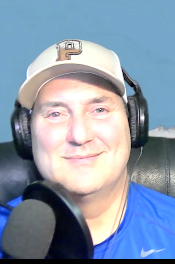 Cplor head shot of Darin Hayes in headphones