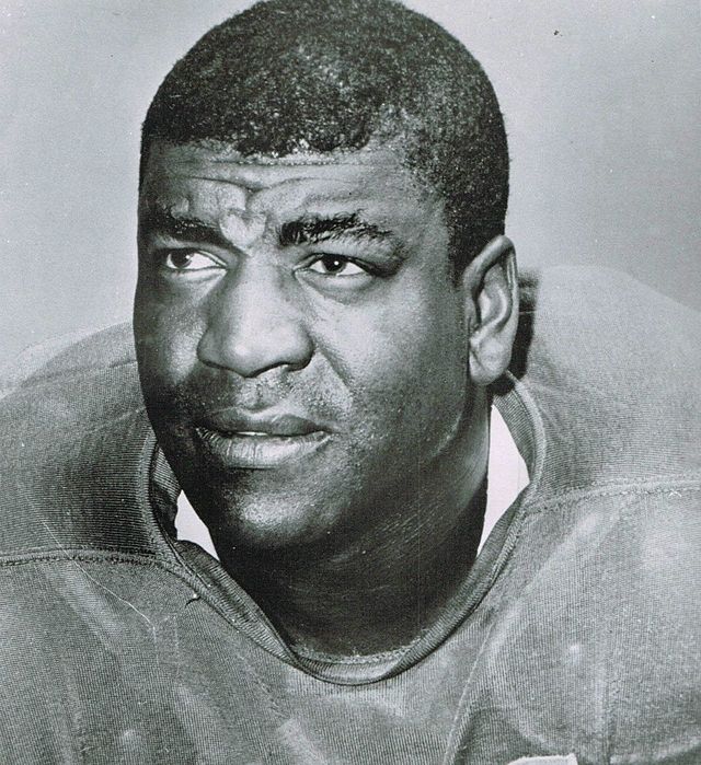 Archival 1962 portrait of Detroit Lions legendary cornerback Dick 'Night Train' Lane. High-contrast black and white headshot showing Lane in his Honolulu blue jersey. A primary source for historical NFL defensive research and Pigskin Dispatch archives.