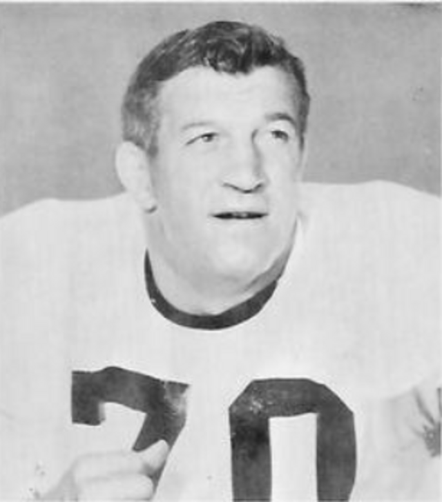 Vintage archival portrait of Pittsburgh Steelers legendary defensive tackle Ernie Stautner (#70). Black and white headshot showing Stautner in a white block-number jersey. A primary source for historical Western Pennsylvania football research and Pigskin Dispatch archives.