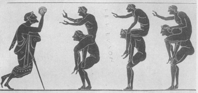 The scene is rendered in the black-figure pottery style, common in Athens between 525–475 BCE. It features a procession of men engaged in "piggyback" rides. On the far left, a bearded figure—likely a referee or instructor—stands leaning on a staff, holding a ball aloft as if preparing to launch it into play. Three pairs of nude athletes follow him; in each pair, a "carrier" supports a "rider" on their back.