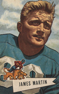 The image is a color-tinted portrait of Jim Martin, characteristic of the 1951 Bowman set. Martin is depicted from the chest up, looking off-camera with a stoic expression. He wears a teal-blue Detroit Lions jersey with silver/white block numbers (partial "80" visible). A unique feature of this set is the small "pennant" logo in the foreground, showing a player riding a lion—a direct nod to the Ephedrismos "piggyback" tradition you've archived.