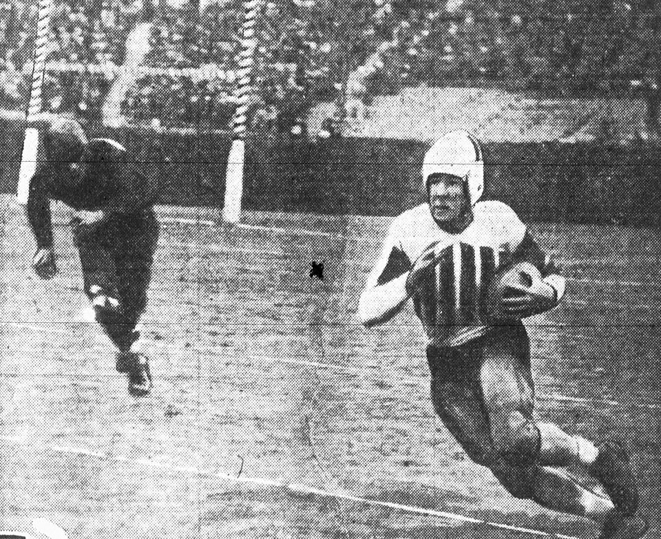 Vintage black and white game action photo of Alabama Crimson Tide football player John Campbell with the ball during the 1931 Rose Bowl on January 1, 1931 in Pasadena, California.