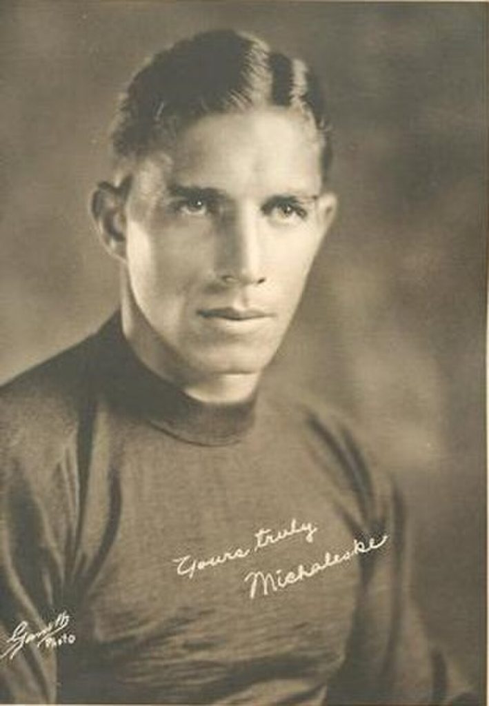 Vintage publicty black and white photo of A football card portrait of Mike Michalske from the 1932 Walker's Cleaners Green Bay Packers set. Walker's Cleaners and Tailors, Green Bay, Wisconsin. Photographer unknown.