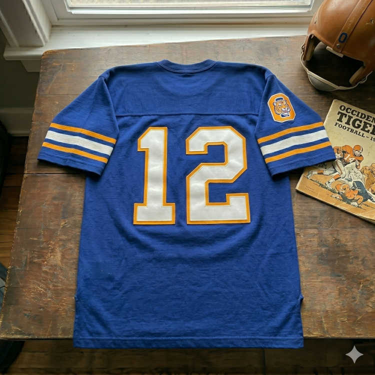 Vintage Occidental Tigers #12 football jersey. Royal blue with gold-outlined white block numbers, 1950s Occidental game program, and vintage leather helmet for historical Southern California sports research and Pigskin Dispatch archives.