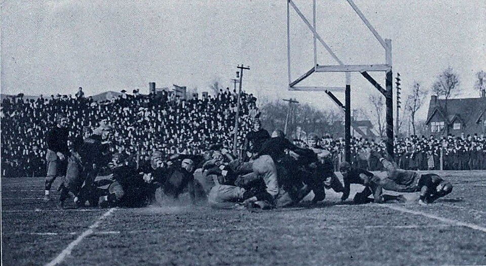 Vintage black and white game action Photograph of football game between Michigan and Minnesota, November 20, 1909