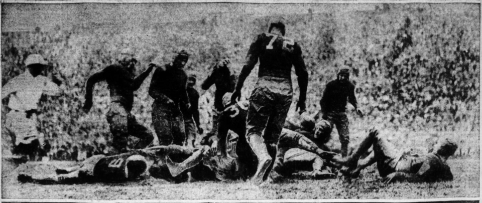Vintage newspaper photo of game action in Scene from the 1927 Georgia vs. Georgia Tech football game. The caption in The Atlanta Constitution reads: