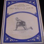 Vintage off white game program cover with blue border and an image of a player kneeling, Photo of my 1929 Ole Miss vs. Mississippi A&M football program University of Mississippi