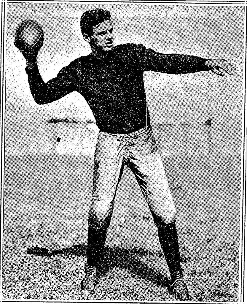 Vintage newspaper publicity phot of Harvard's Barry Wood in a football action pose throwing the football.