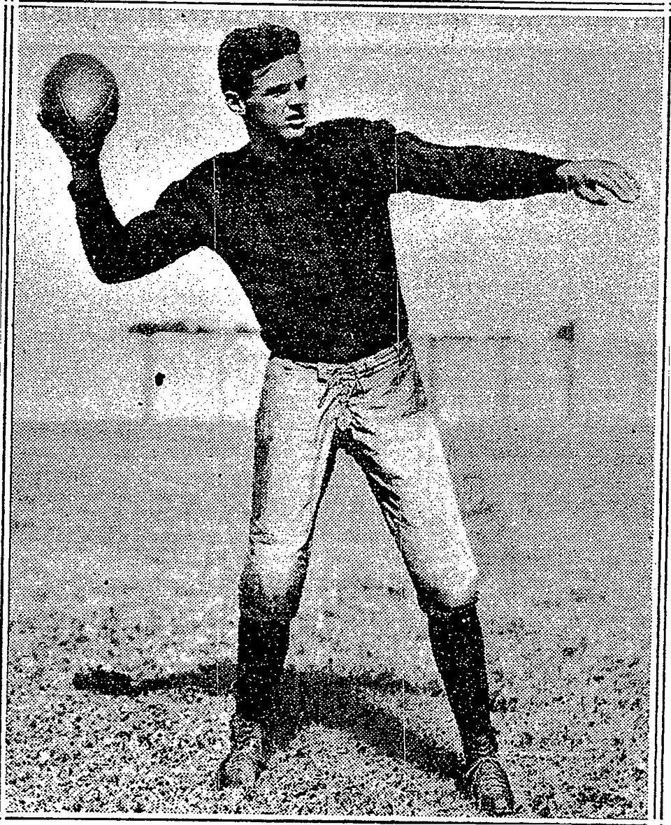 Vintage newspaper publicity phot of Harvard's Barry Wood in a football action pose throwing the football.