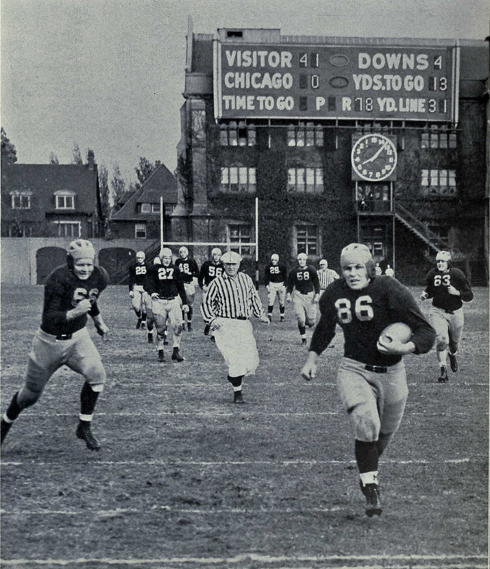 Black and white game  action photo of Westfall runs for a touchdown against Chicago, 1939.

