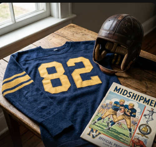 Vintage Navy Midshipmen #82 football jersey as seen in Brown_Navy_82.jpg. Features a navy blue durene jersey with gold felt numbers, a classic leather 'Flat Top' helmet, and a historical Midshipmen official program for Service Academy