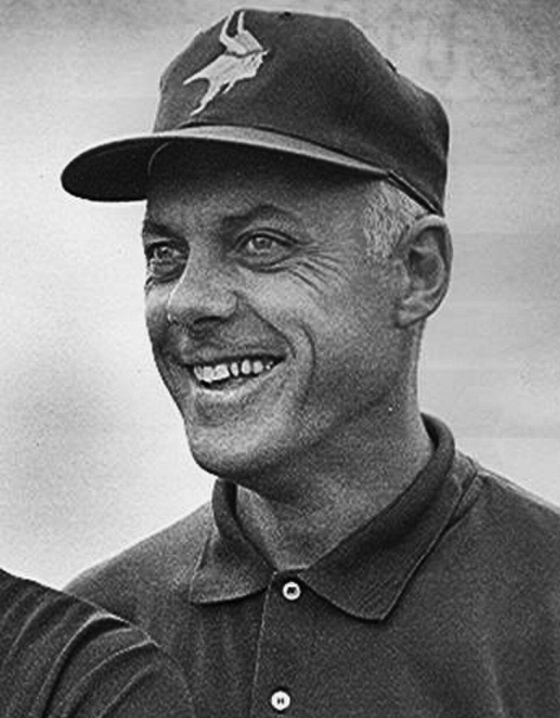 Black and white cropped head shot of Minnesota Vikings legendary coach Bud Grant in 1968, wearing a Vikings cap.