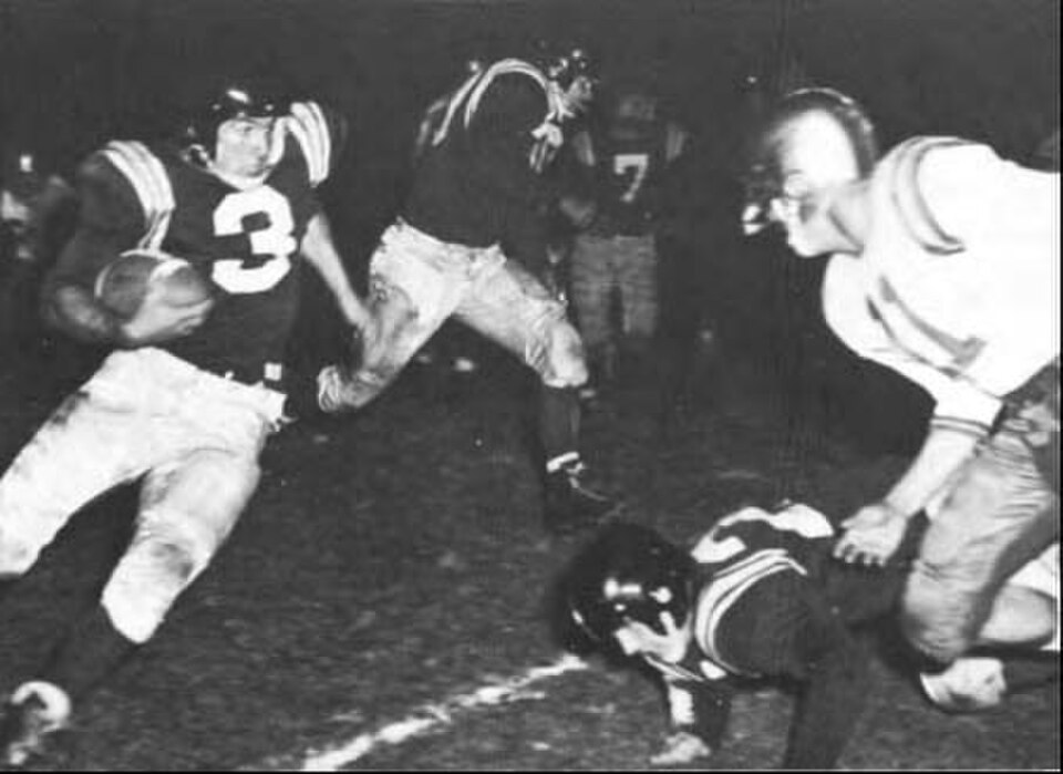Vintage black and white game action photo of the Cal Poly v the University of California, Santa Barbara, in 1955.