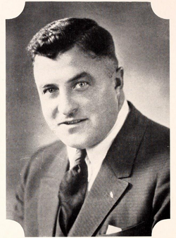 Vintage blackand white publicity head shot photo of Coach Earl Abell