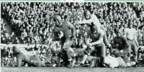 Vintage newspaper photo image of game action of DePaul vs. Loyola Chicago football 1930