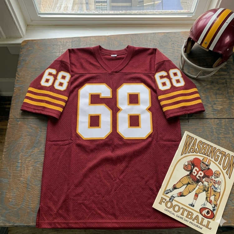 Vintage Westminster #68 football jersey. Maroon mesh with white and black shadowed block numbers and triple-striped sleeves.