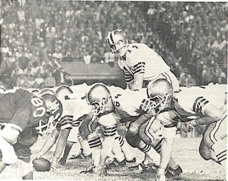 vintage black and white game action photo of A 1968 football game between the Houston Cougars and the Florida State Seminoles, with quarterback Bill Cappleman about to take the snap
