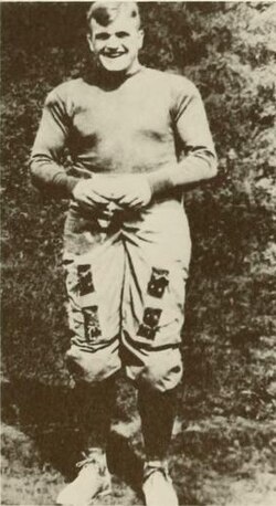 Vintage black and white publicity photo pof West Virginia Mountaineer Ira Rodgers in full early twentieth century football uniform.