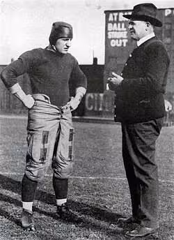 vintage black and white photo of Pitt's Bob Peck with his head coach "Pop" Warner during the 1916 season.
