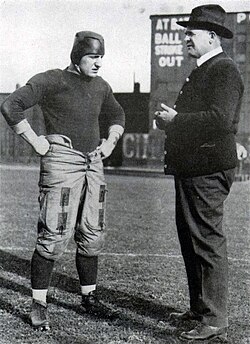 vintage black and white photo of Pitt's Bob Peck with his head coach "Pop" Warner during the 1916 season.