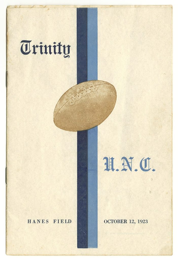 Vintage, yellowed white cover with blur black and tan color printing of a football and words to express that it is a program cover of The cover of an American football game of Trinity College (now known as Duke University)