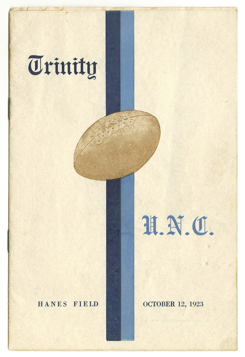 Vintage, yellowed white cover with blur black and tan color printing of a football and words to express that it is a program cover of The cover of an American football game of Trinity College (now known as Duke University)