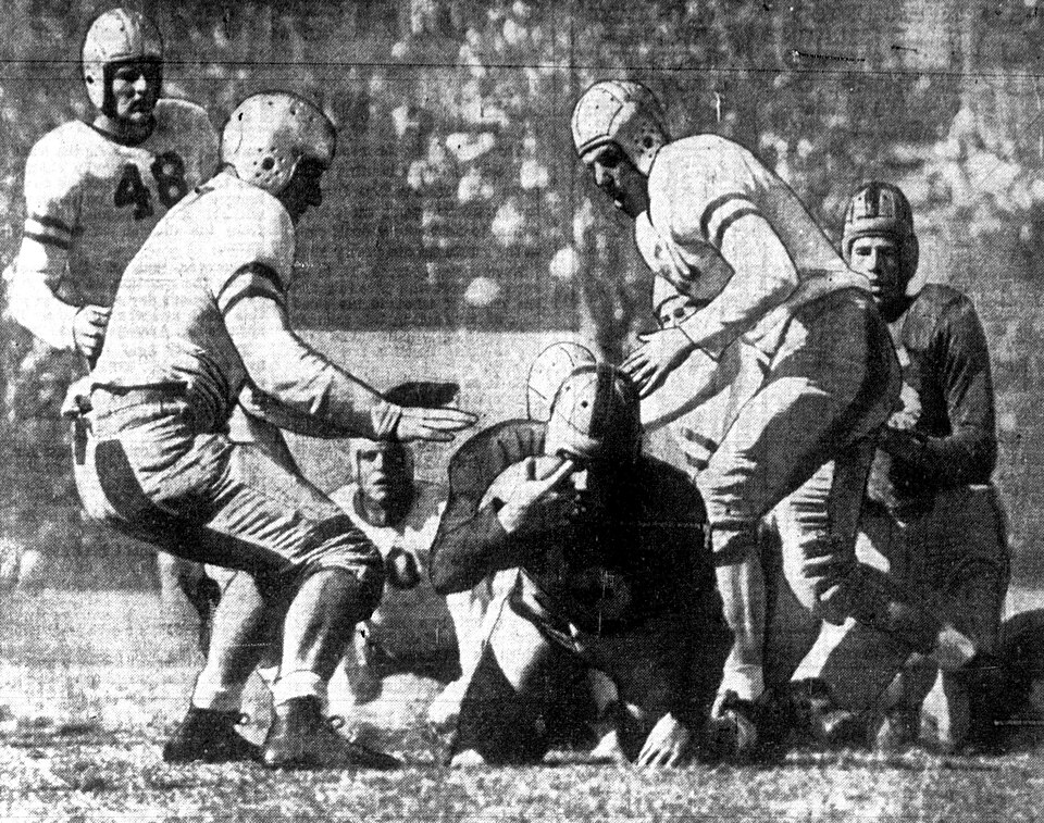 Black and white newspaper image of An image from the Los Angeles Daily News of the football game on October 18, 1942 between the UCLA Bruins and the University of California, Berkley at Los Angeles Memorial Coliseum in Los Angeles, California.
