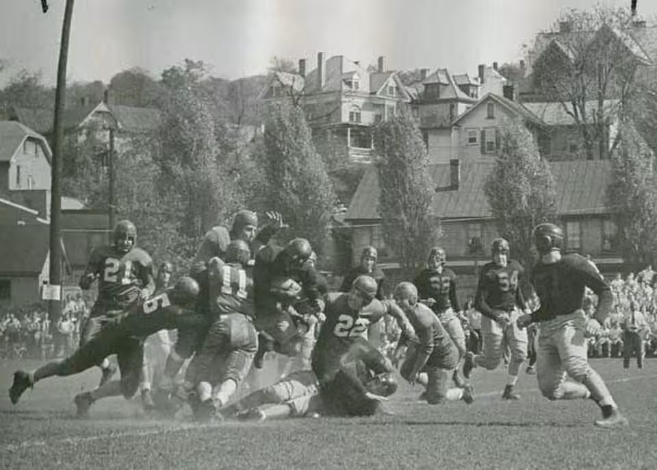 Vintage black and white game action of Washington & Jefferson College football team in 1946