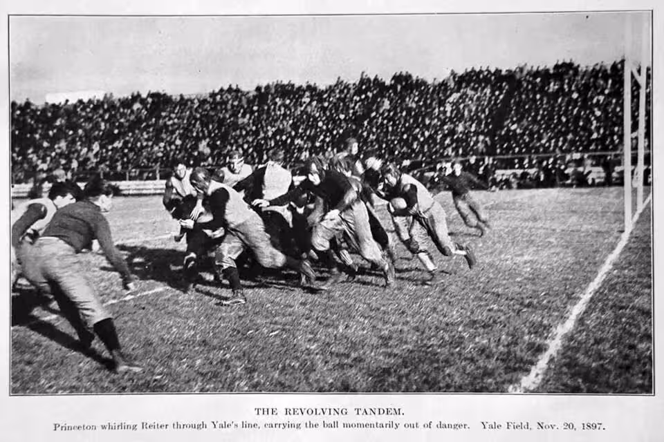 Vintage black and white game action photo from the Yale vs. Princeton game at Yale Field on Nov 20, 1897.