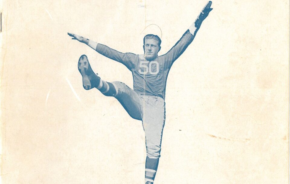 Plain manilla colored program cover with blue and gray writing an an image of Giants player number 50 in a football pose.