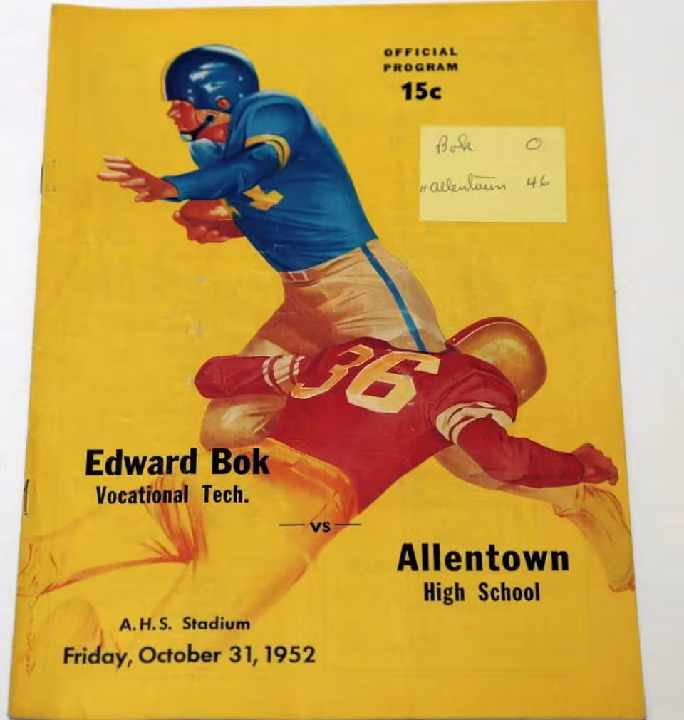 Full color hand drawn water color illustration of 1952 high school football action play of a runner avoiding a tackle for Bok VT vs Allentown High School Football Program - Allentown PA