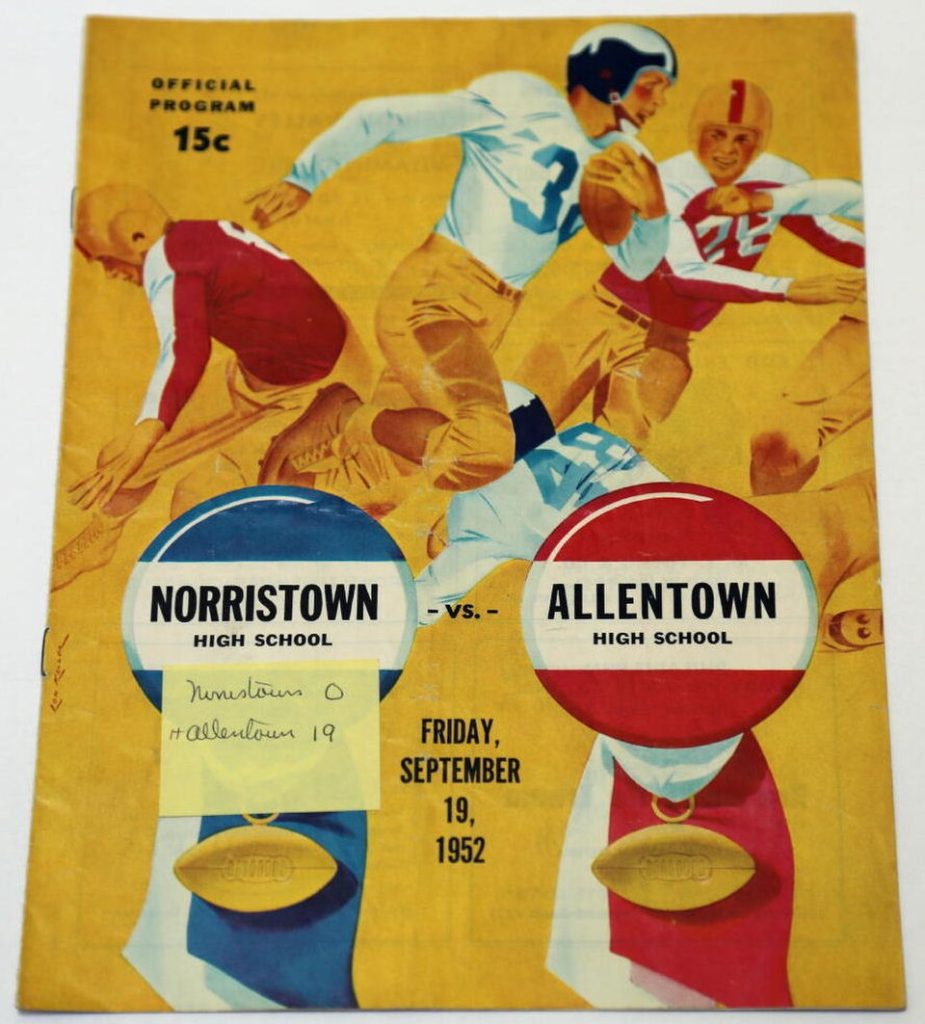 Vintage September 19, 1952, Norristown vs. Allentown High School football program cover by Lon Keller. Features an illustration of a ball carrier in a white jersey (#31) and blue helmet cutting past defenders on a gold background. Two large prize ribbon graphics display the team names, with a handwritten yellow sticky note recording a score of Allentown 19, Norristown 0. Priced at 15 cents. A primary source for Pennsylvania high school gridiron history and Pigskin Dispatch archives.