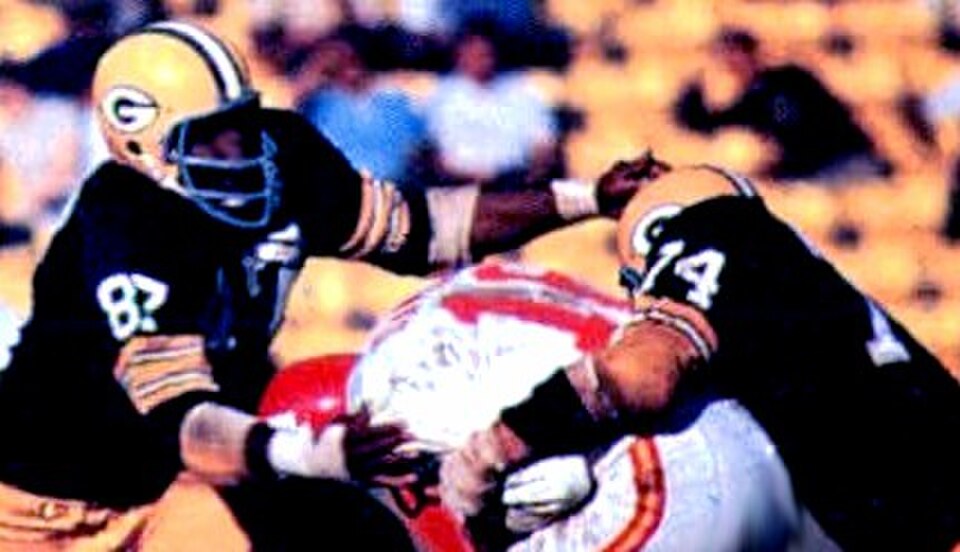 Full color game action image of Green Bay defenders in 1967 sacking (not a term used in that era) KC QB Len Dawson