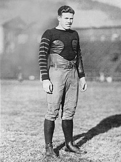 Vintage black and white publicity shot of Cal's Harold Muller, in full football uniform, minus helet, circa 1921.